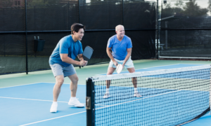 2 men playing pickleball