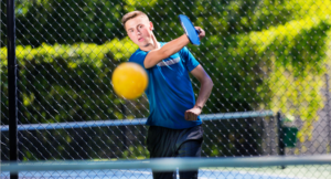 young man playing Pickleball