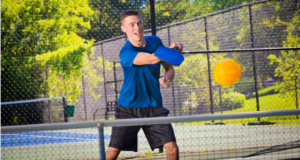 Young Man Serving Pickleball