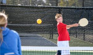 Young Boy playing Pickleball