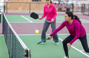 women playing Pickleball