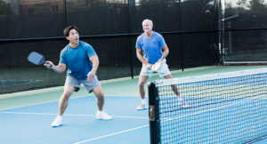 2 old men playing Pickleball